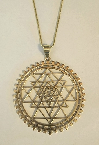 https://www.magicalomaha.com/resize/Shared/Images/Product/Bold-Bronze-Sri-Yantra-Necklace-Sacred-Geometry/SriYantraPendant.jpg?bw=500&bh=500